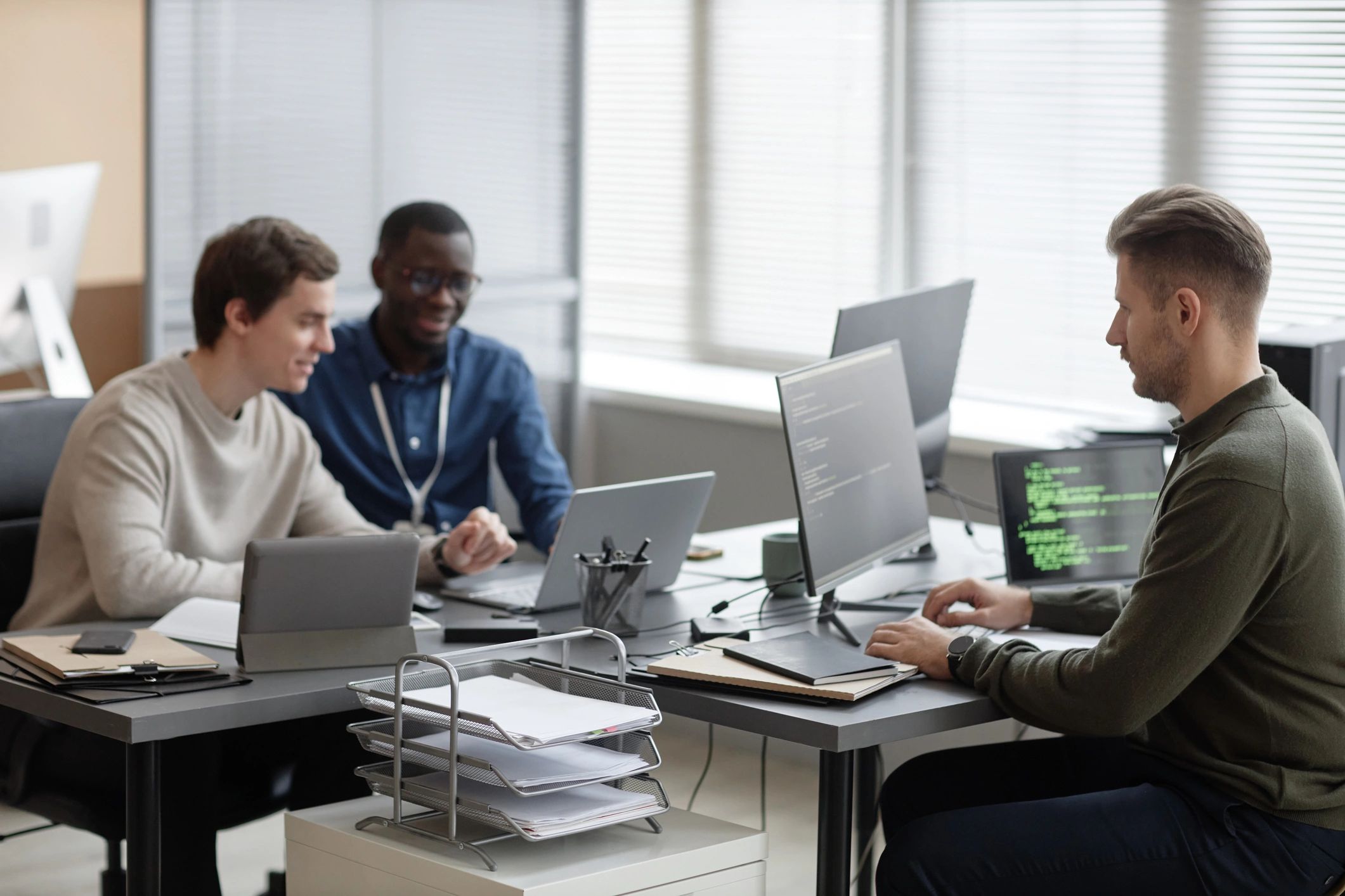 Programmers collaborating in a modern office